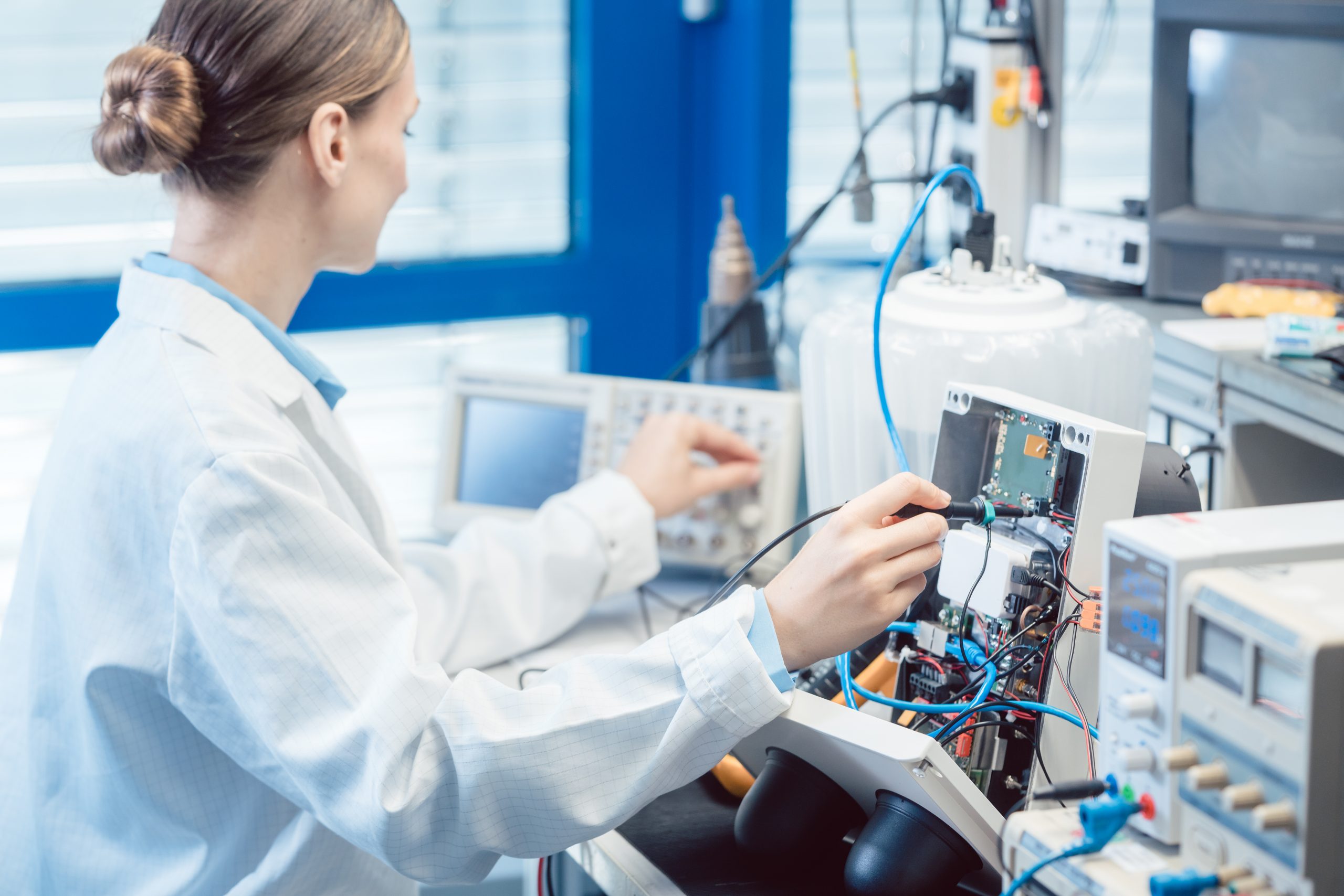Engineer woman measuring electronic product on test bench 5 stress-free ways to upskill your technical knowledge in STEM
