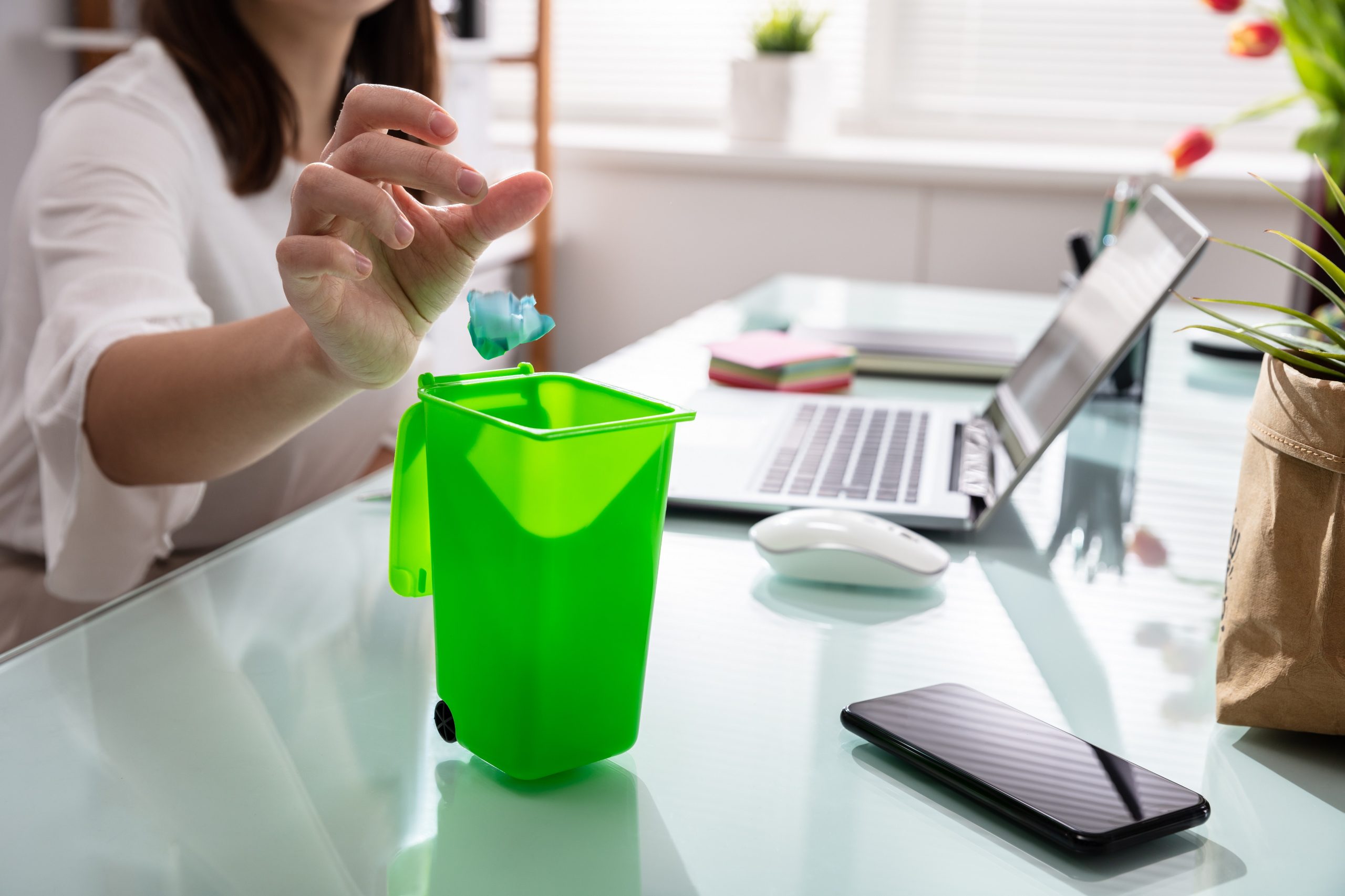 Woman Throwing Crumpled Paper In Dustbin Recruiting, strategy, and culture: Make your organisation more sustainable