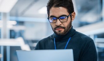Close Up Portrait of a Talented Latin Man Looking at Camera and How can a recruiter help you beat the IT talent shortage?